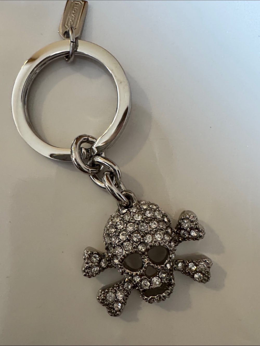 Coach Silver Crystal Skull & Crossbones Keychain